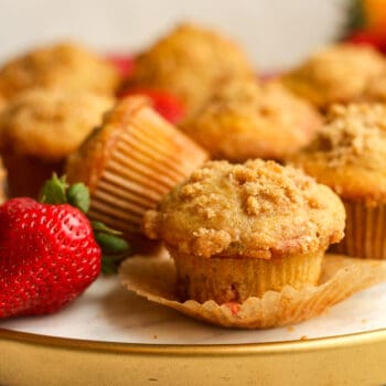 Side view of a tray of rhubarb muffins with streusel topping.
