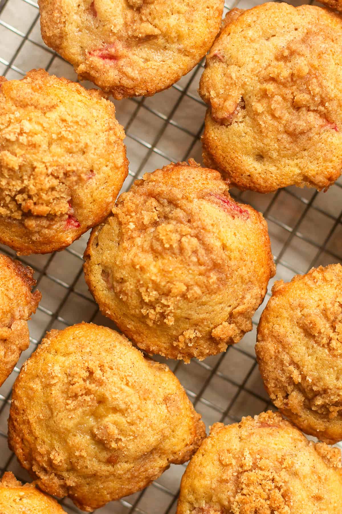 Closeup on a some rhubarb muffins with streusel topping.