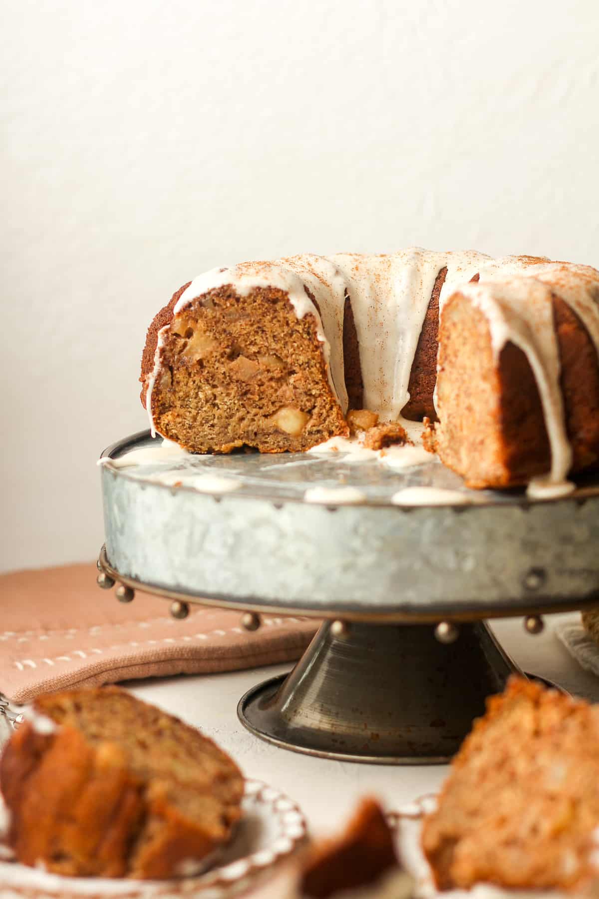 Side view of a cake stand with a partial cake showing the inside.