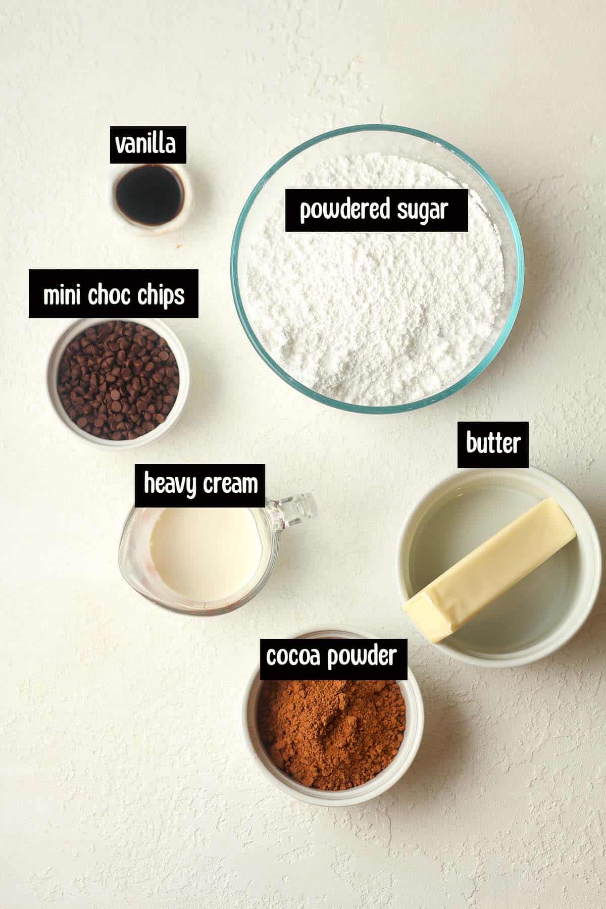 The cake frosting ingredients in bowls.