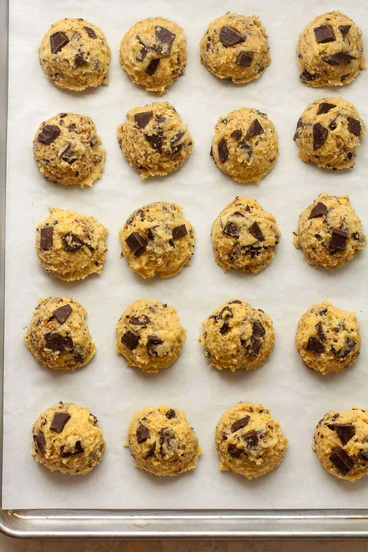 The cookie balls on a sheet pan.