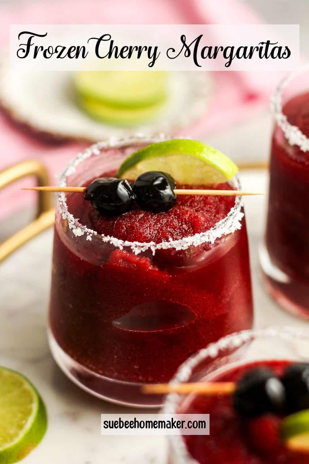 Side view of a glass of frozen cherry margaritas.