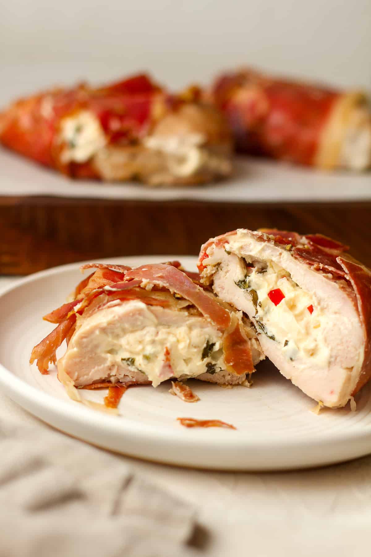 Closeup on a plate of stuffed chicken breast.