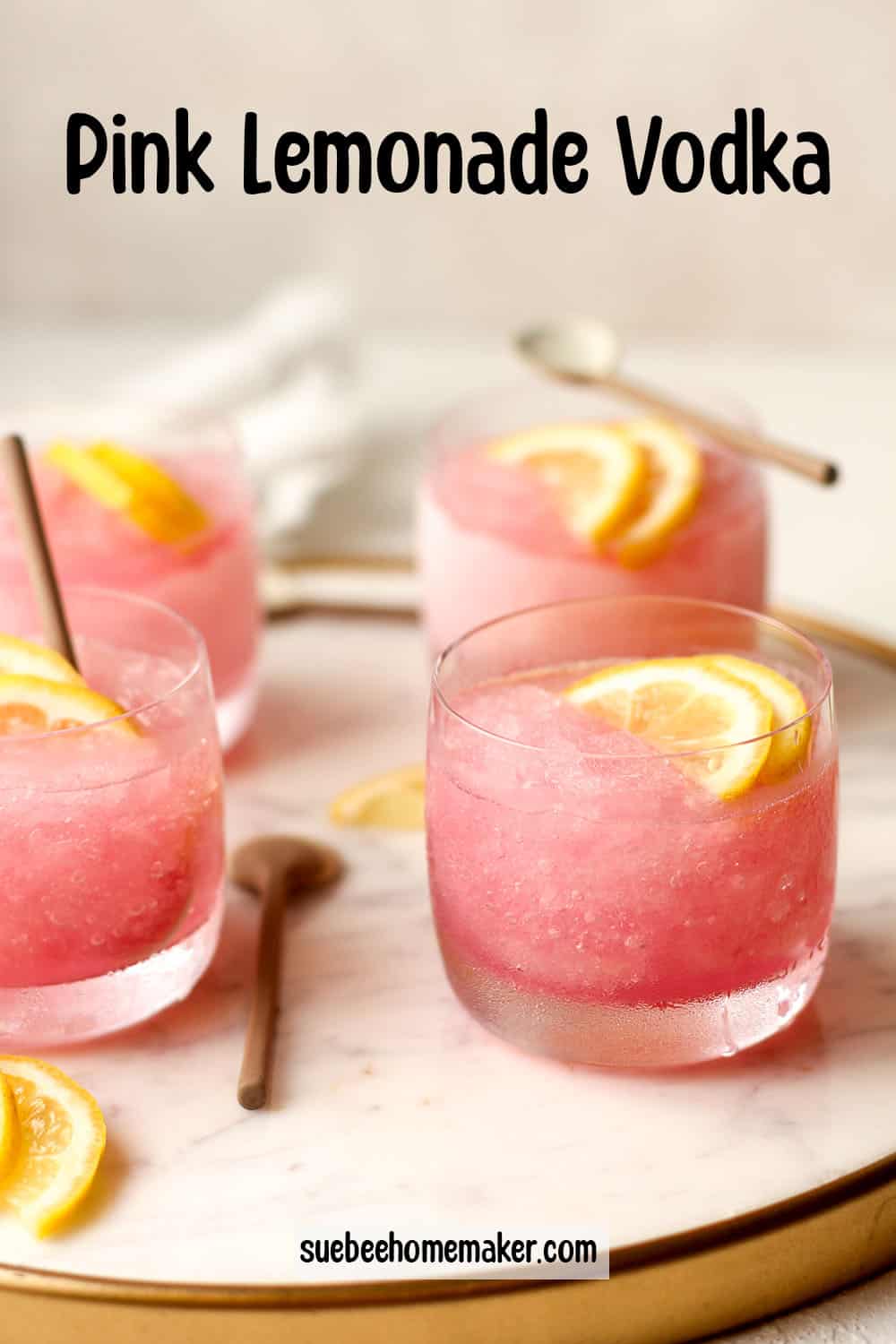 Side view of a tray of pink lemonade vodkas.