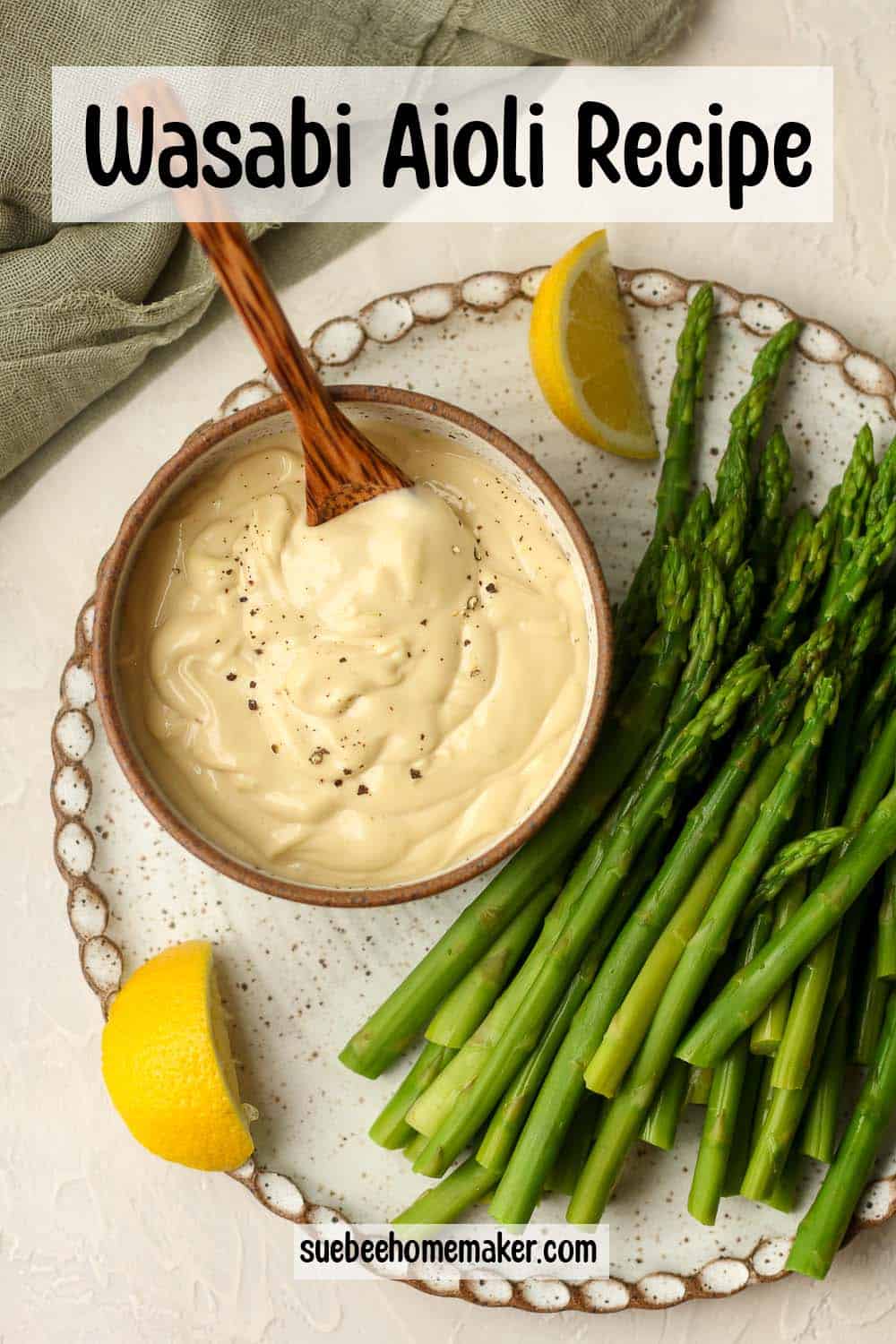A plate of fresh asparagus and a bowl of wasabi aioli.