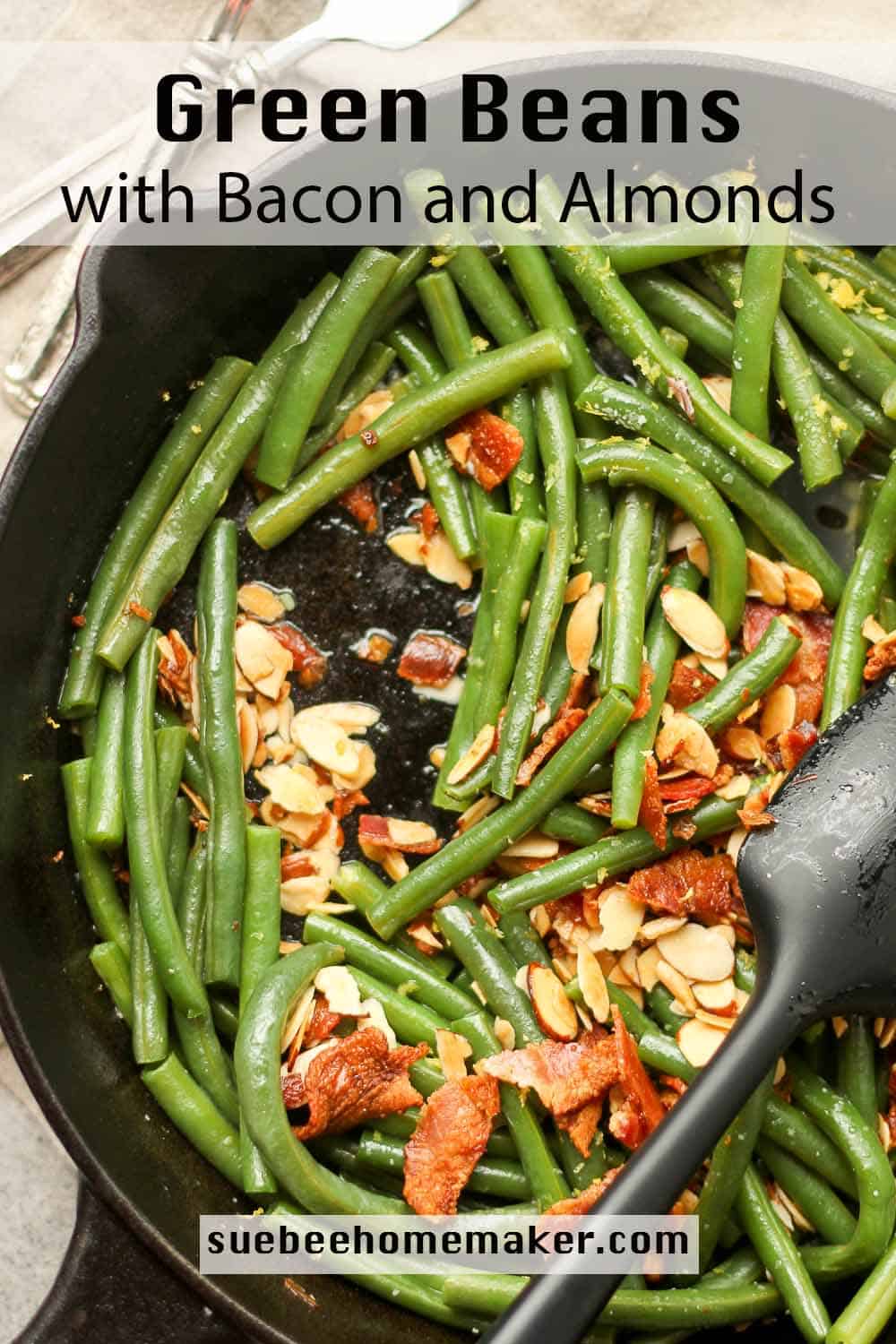 A skillet of green beans with bacon and almonds.