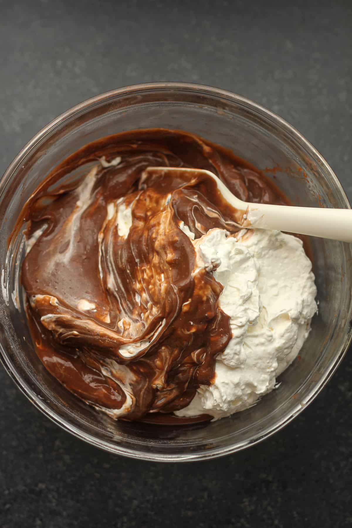 The chocolate pudding on top of cool whip mixture.