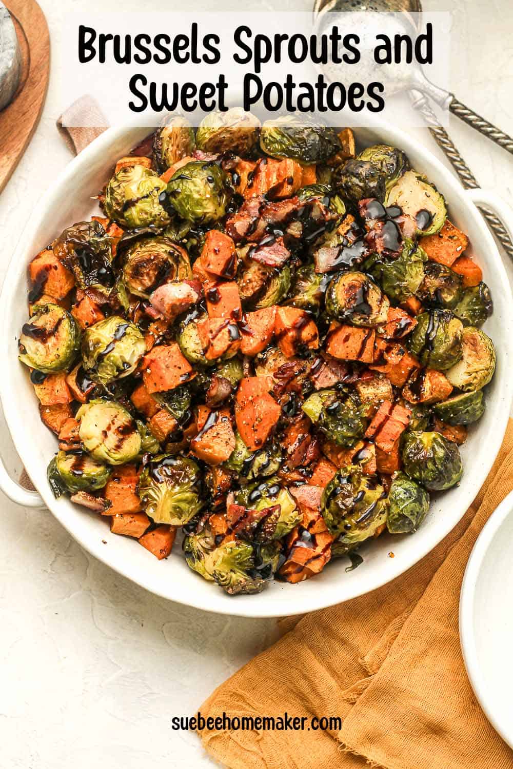 A large serving bowl of brussels sprouts and sweet potatoes with balsamic glaze.