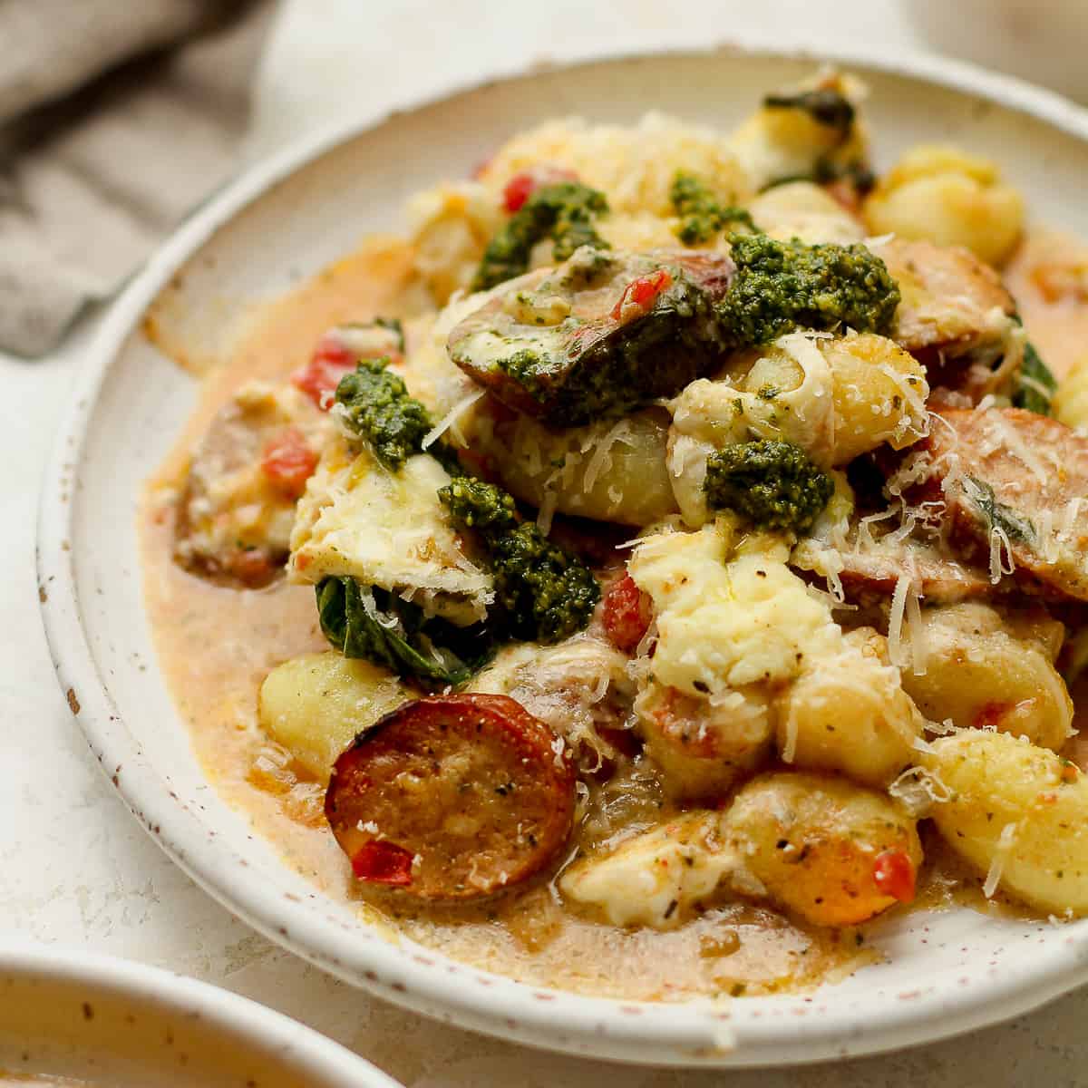 A plate of gnocchi and sausage.