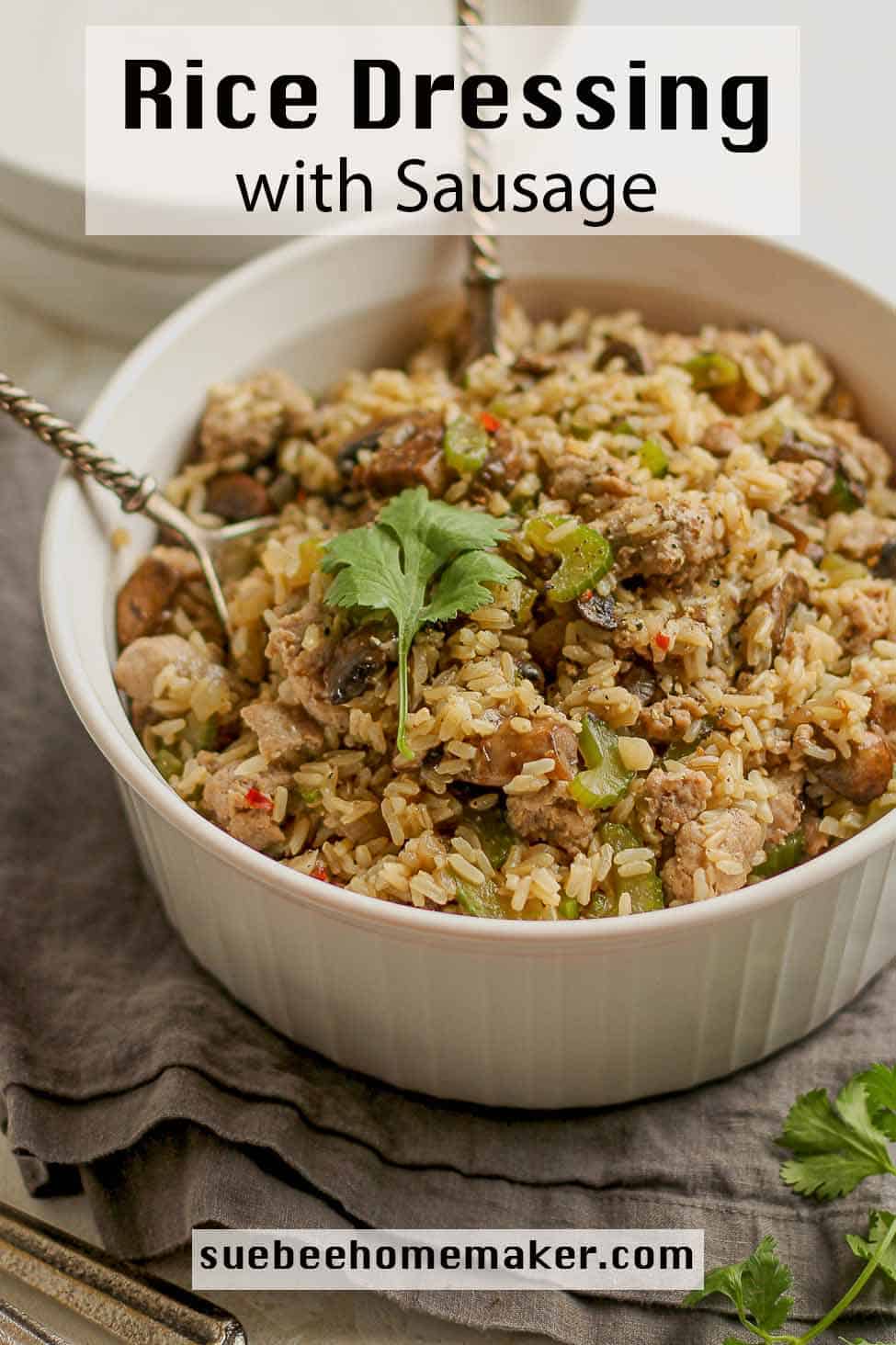 A large dish of rice dressing with sausage and mushrooms.