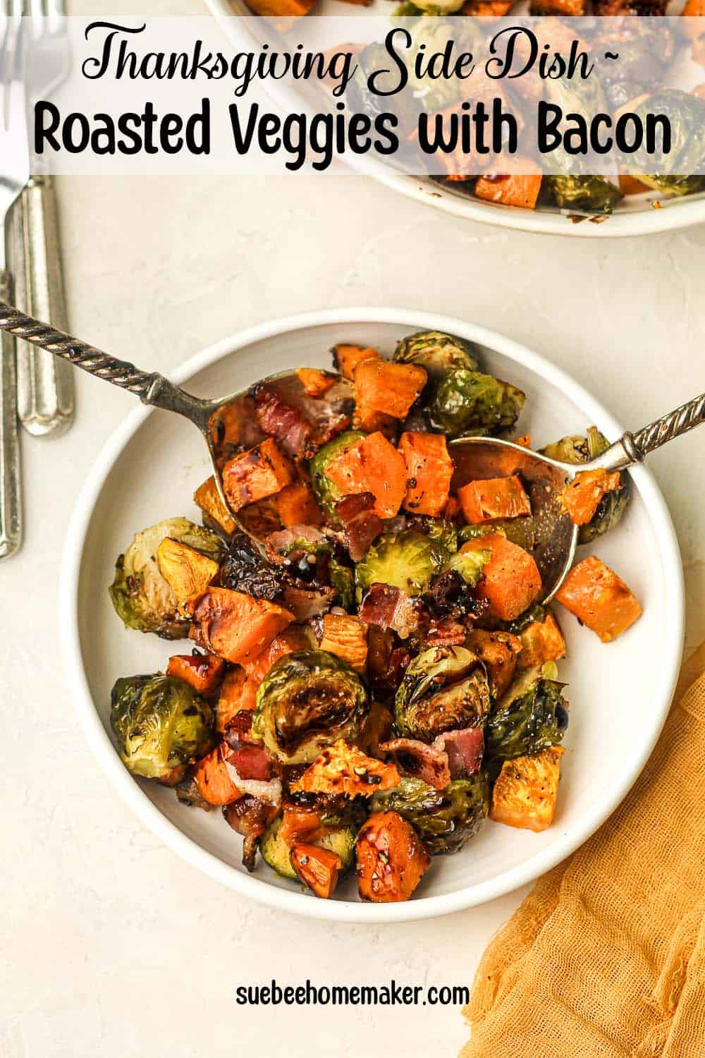 A serving plate of roasted veggies with bacon.