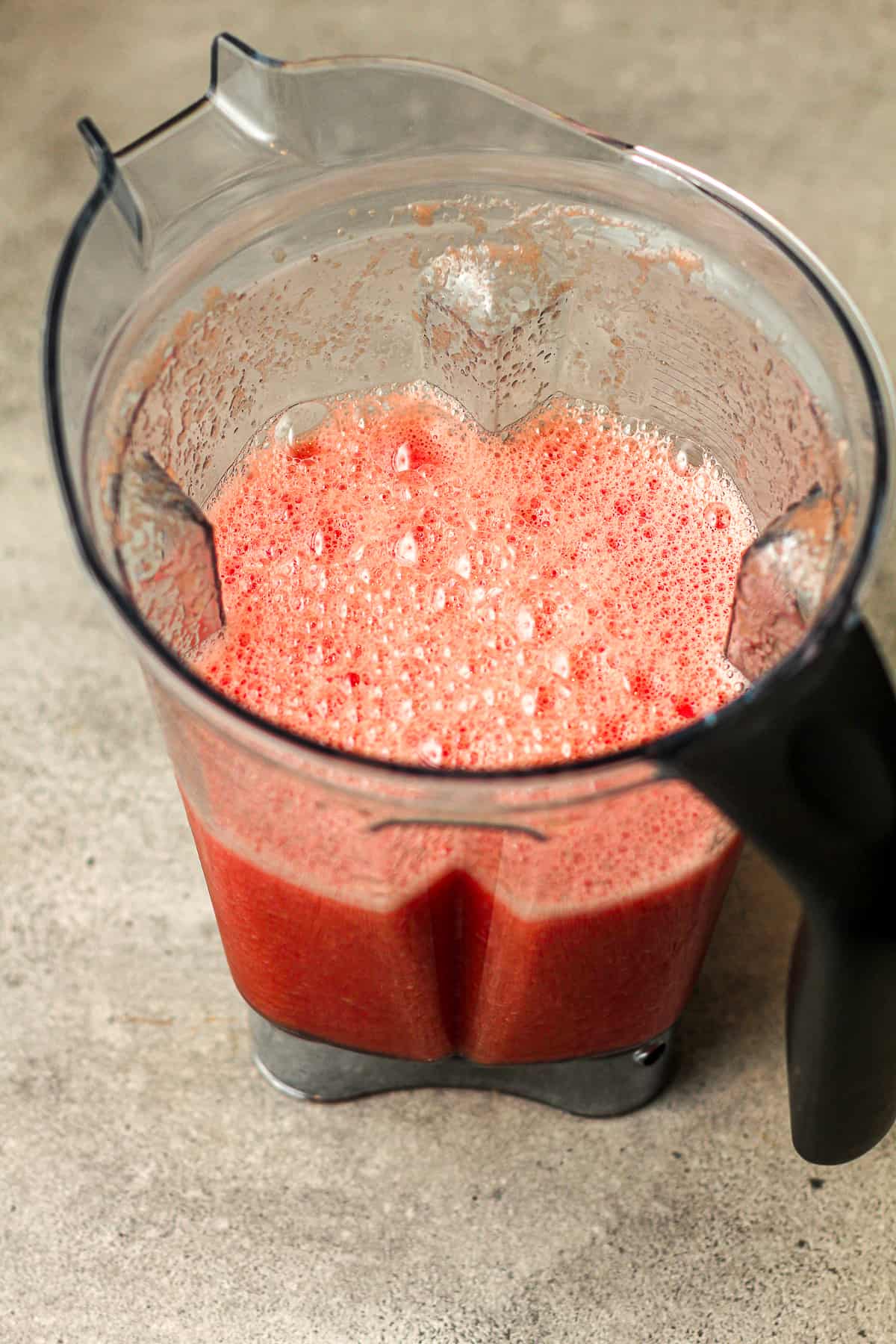 A blender of watermelon juice.