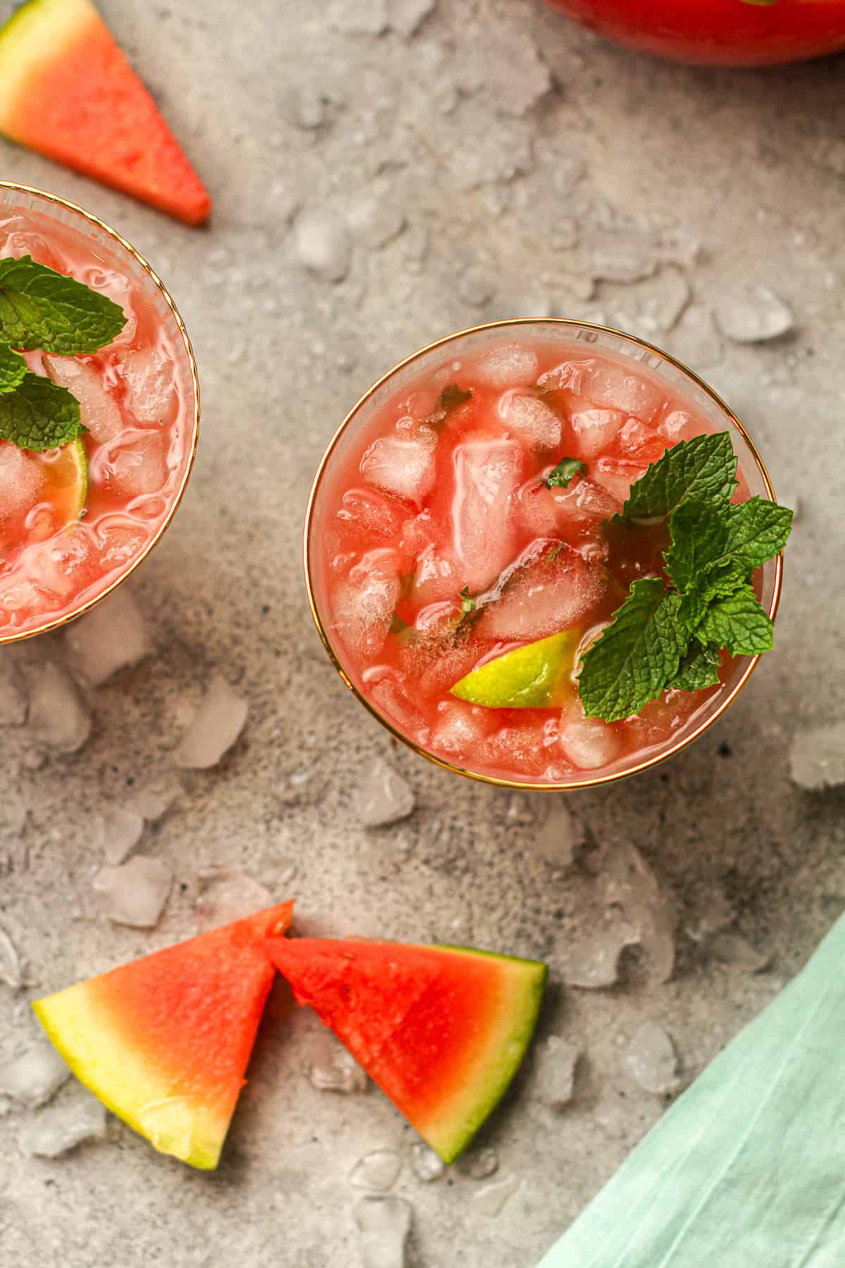Overhead view of two watermelon margaritas with cubed ice.