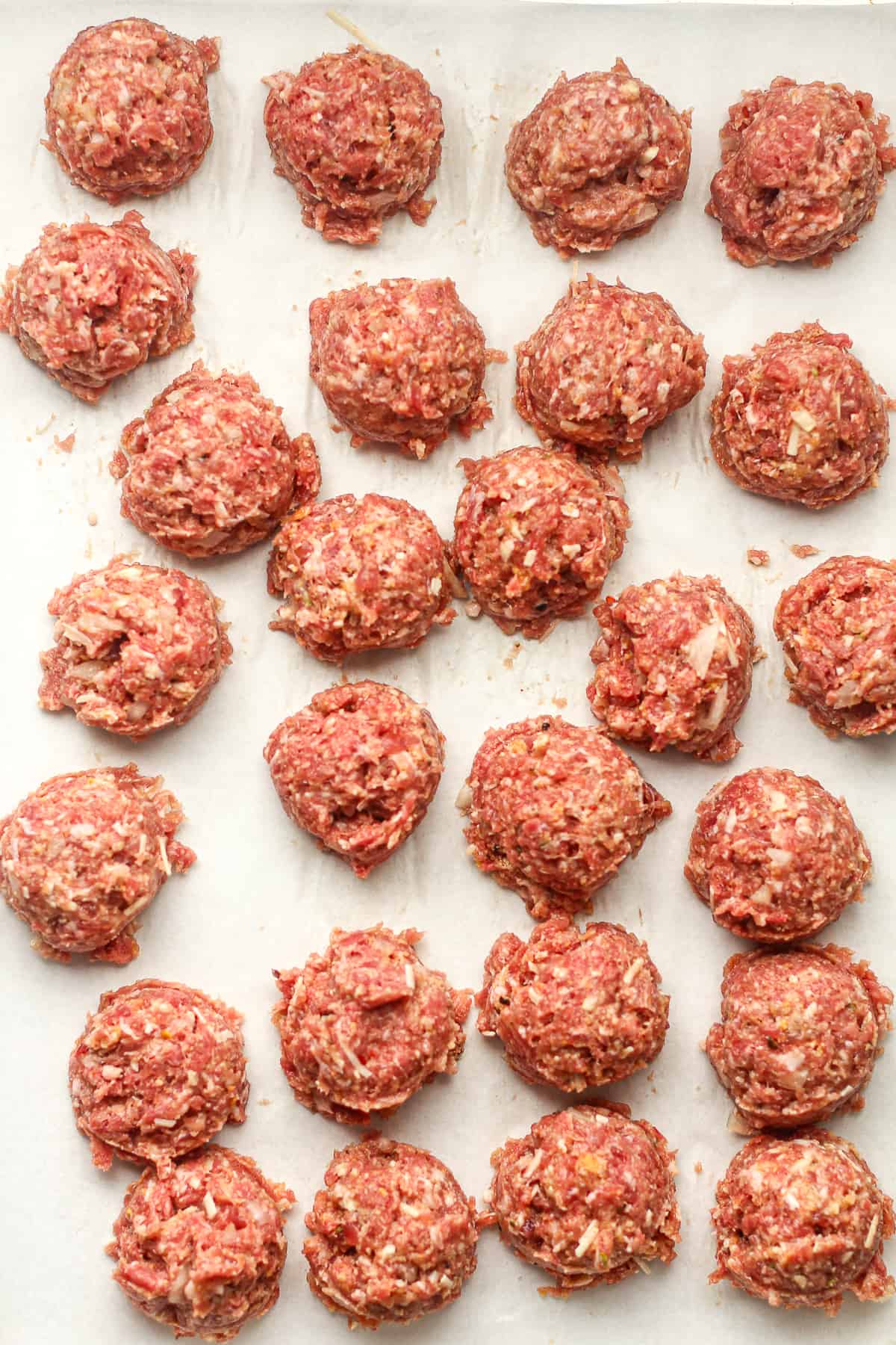 A pan of the scooped meatballs ready to cook.