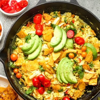 A Mexican Breakfast Skillet with cheese and avocado slices.