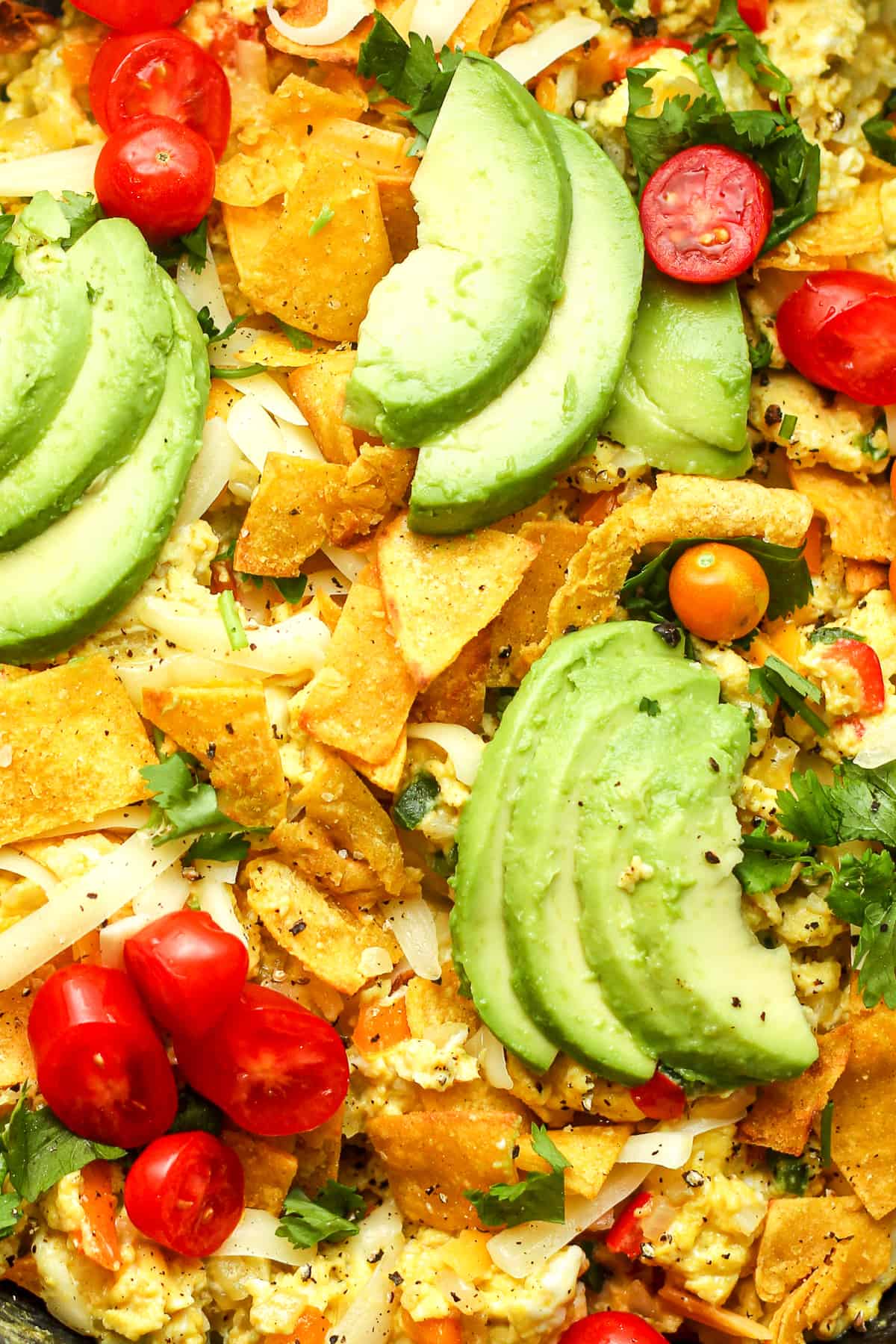 Close pin the Migas with avocado slices on top.