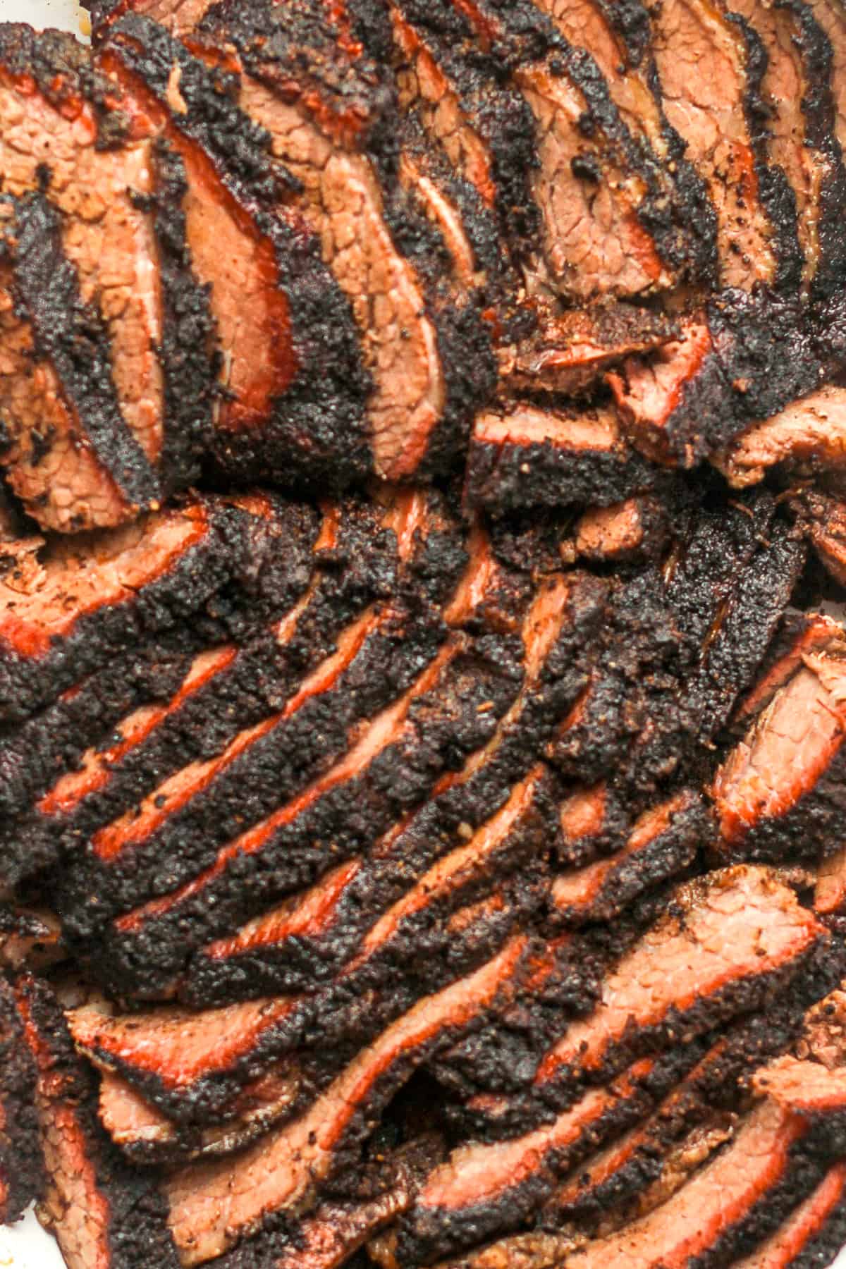 Closeup on slices of smoked brisket.