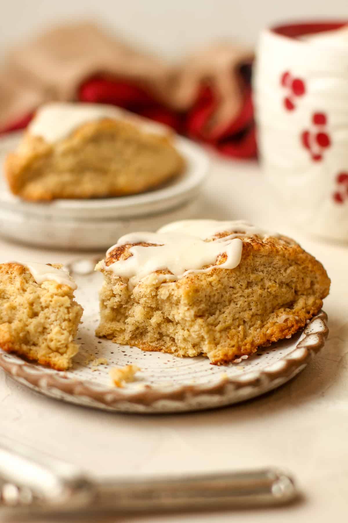 Side view of a partially eaten snickerdoodle scone.