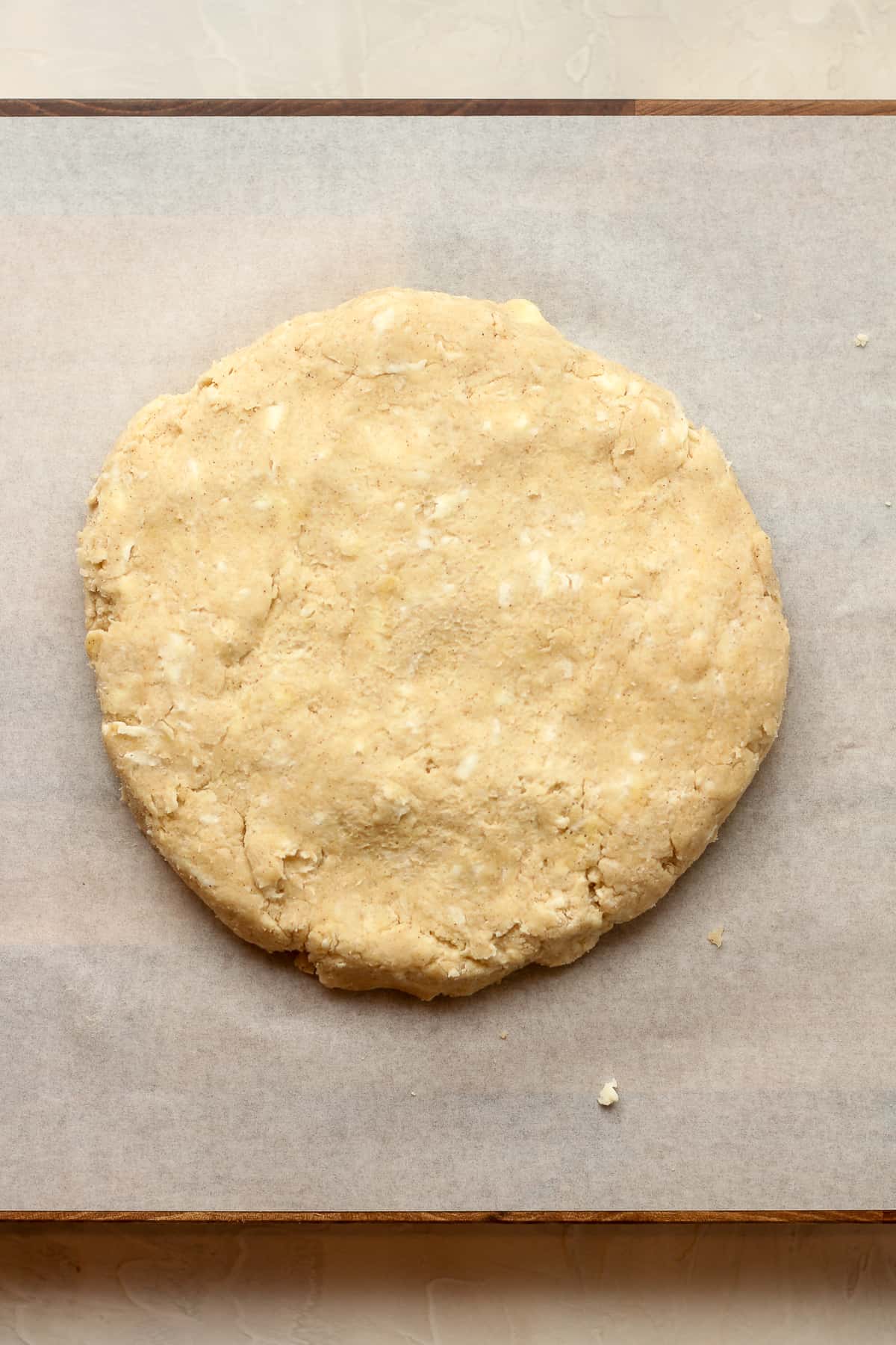 Overhead view of a round of scone dough.