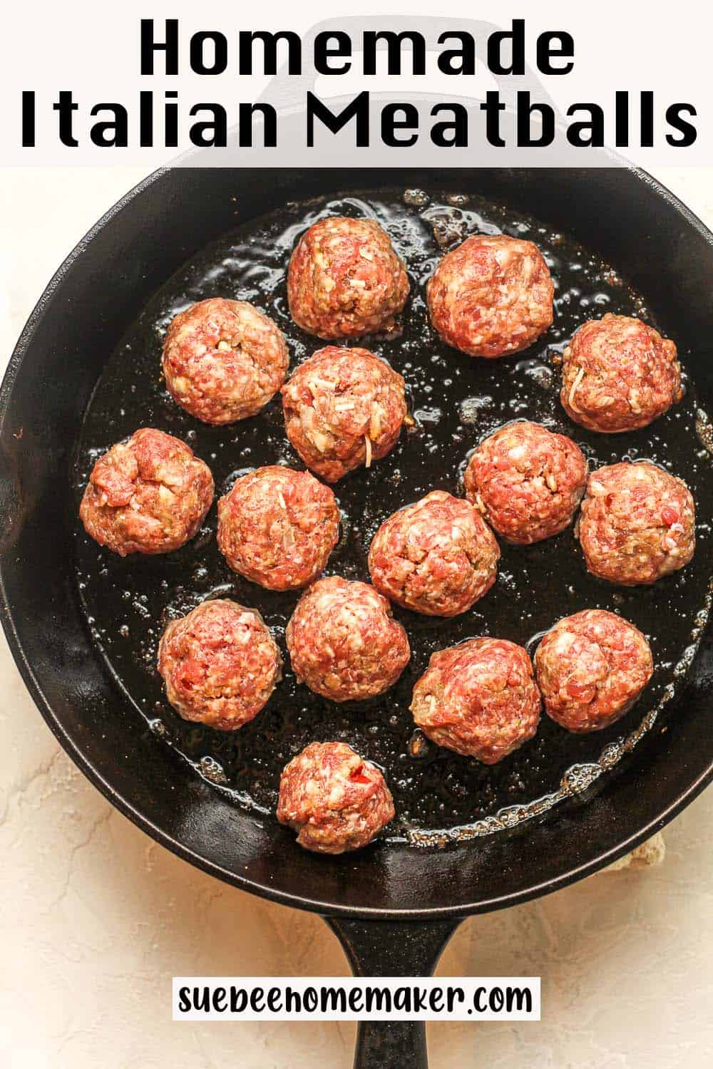 A large cast iron skillet of the homemade Italian meatballs before browning.