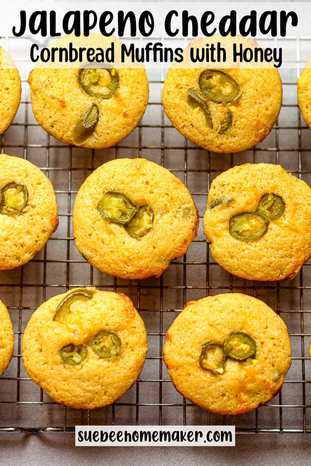 A wire rack of jalapeno cheddar cornbread muffins with honey.