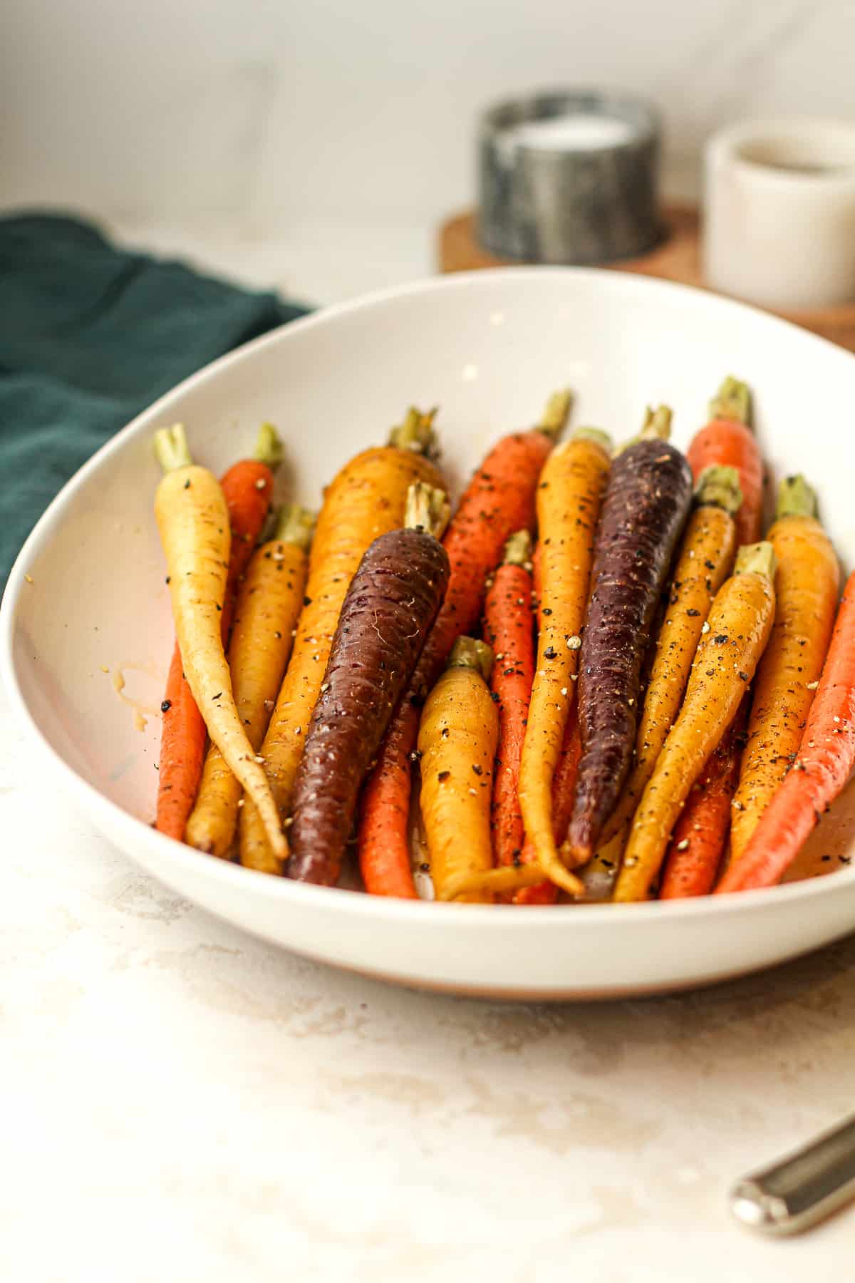 Side dish of some whole maple carrots.