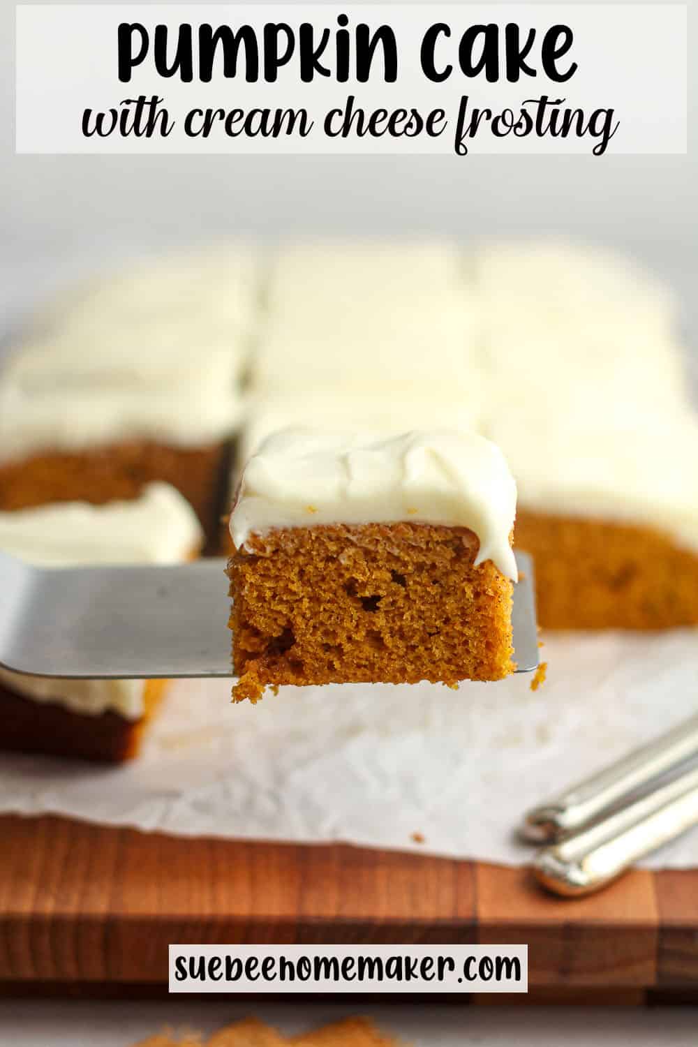 A spatula with a piece of pumpkin cake in front of a board of cake.
