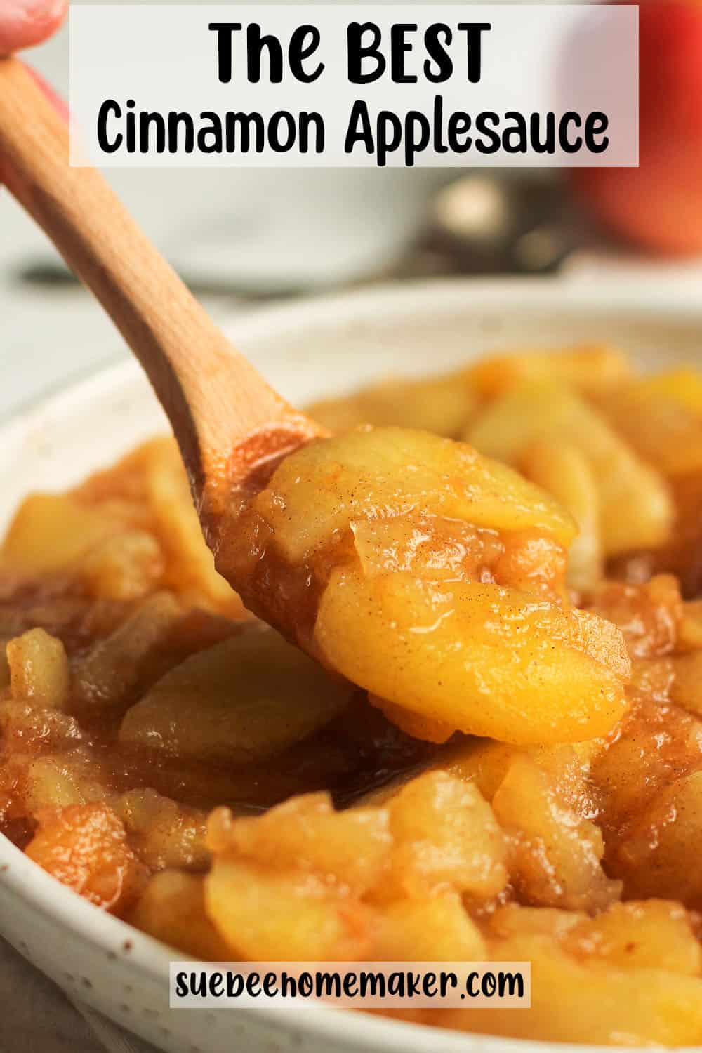 A spoonful of the best cinnamon applesauce out of a bowl.