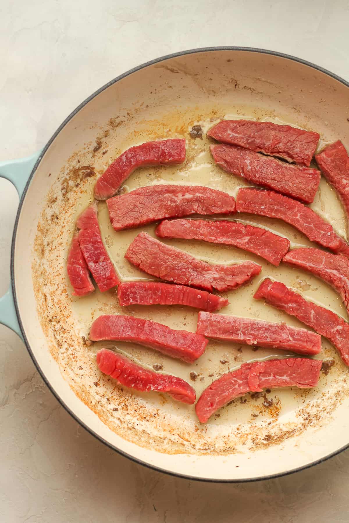 A pan of the raw steak.