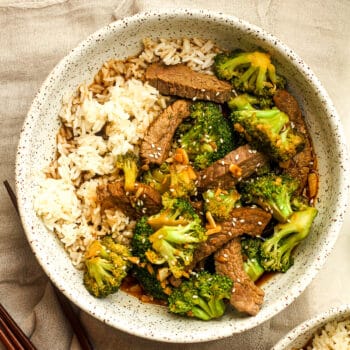 A bowl of beef and broccoli over rice.