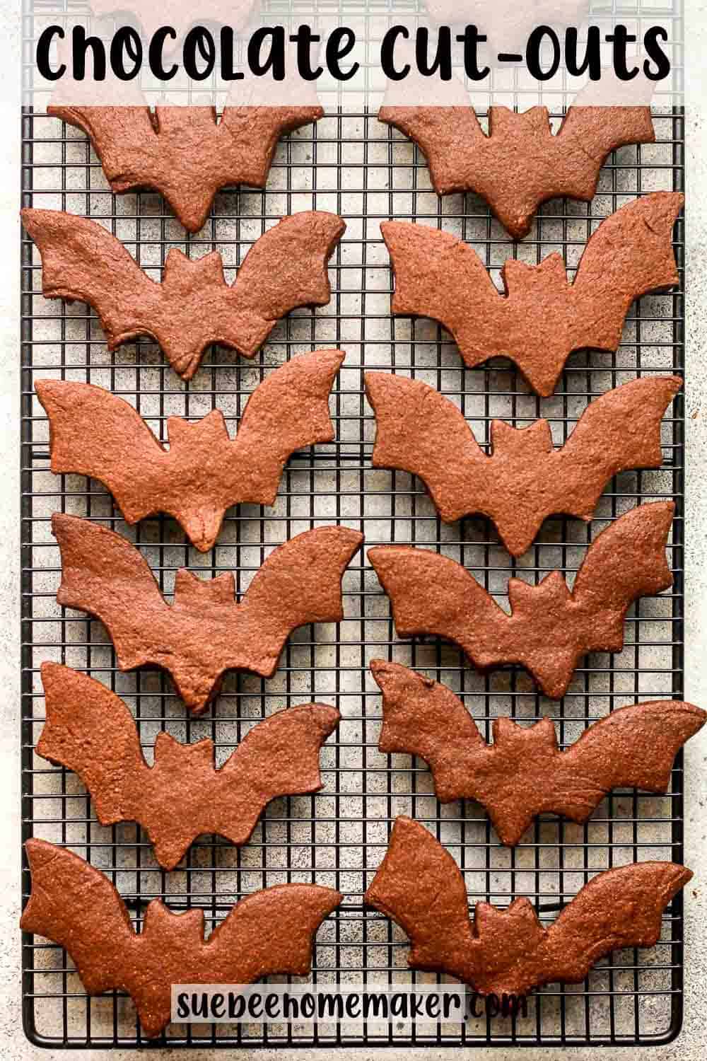 A wire rack of chocolate cut outs in bat shapes.