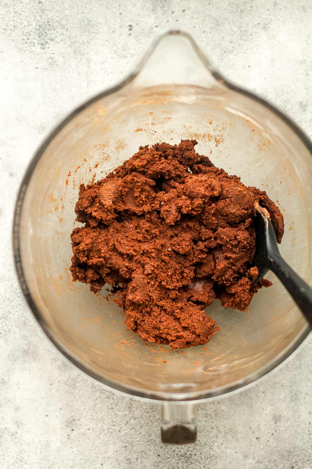 A mixing bowl with the chocolate cookie dough.