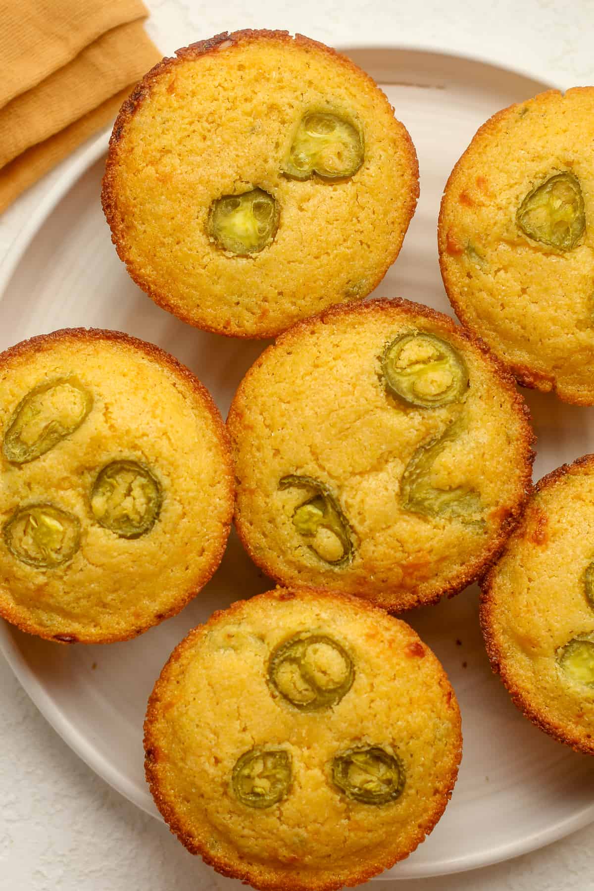 Closeup view of a plate of jalapeno cheddar muffins.
