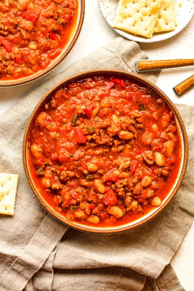 Two bowls of pumpkin white bean chili.