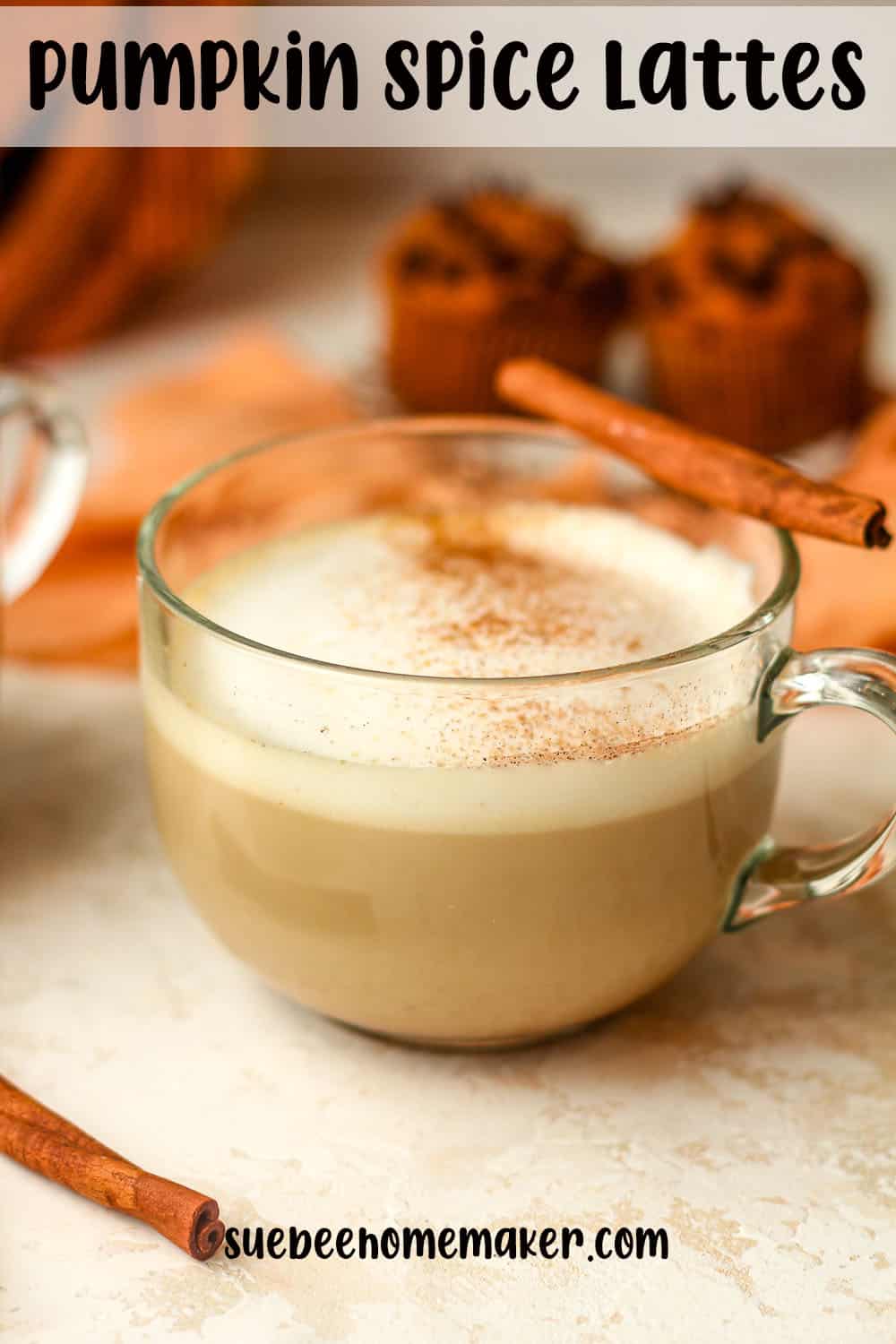 Side view of a pumpkin spice latte with a cinnamon stick.