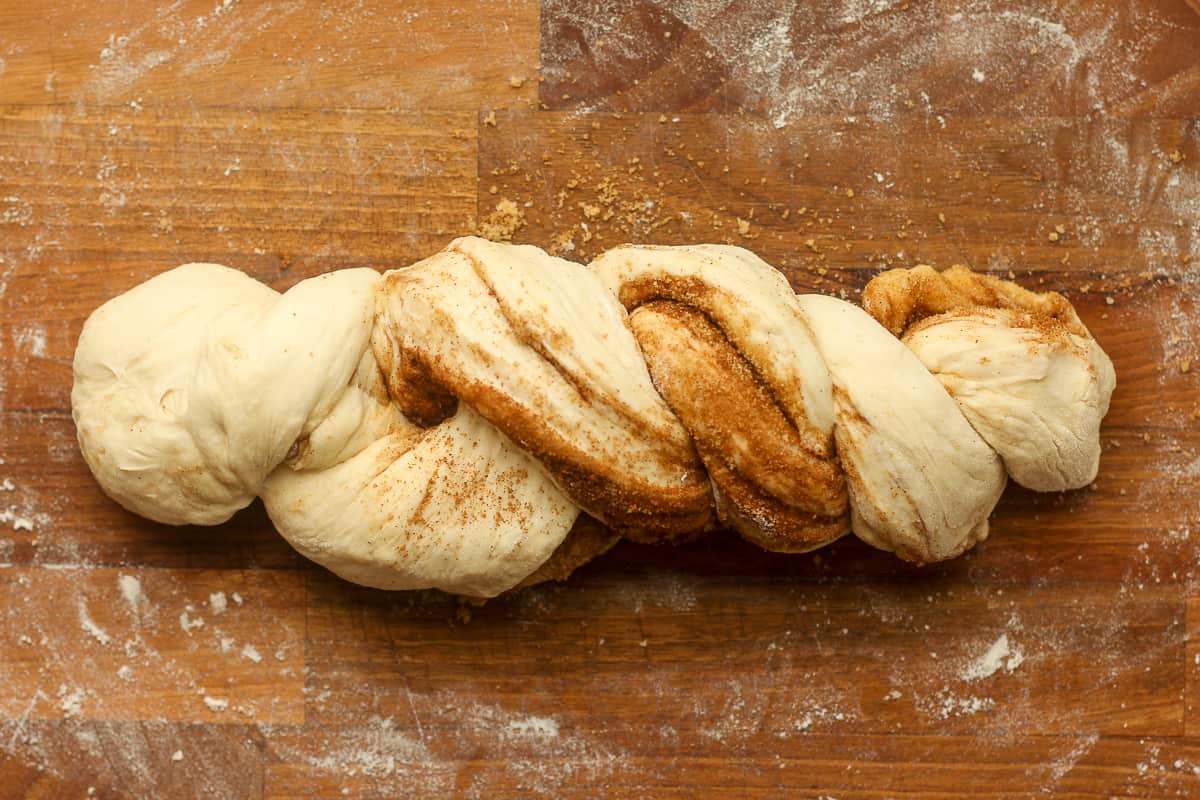 The twisted bread dough on a board.