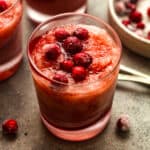 Closeup on a glass of cranberry slush with vodka.