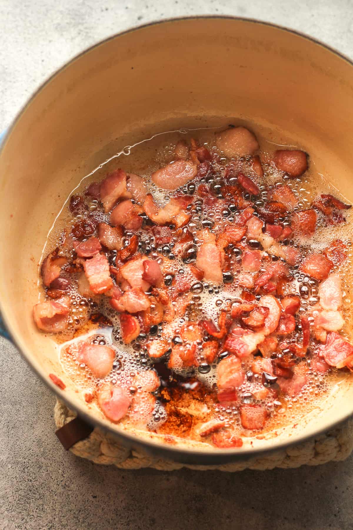 A pot of fried crispy bacon.