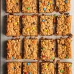 Overhead view of sliced monster cookie bar with mini M&Ms.