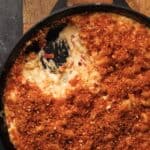 A cast iron skillet of smoked pimento Mac and cheese.