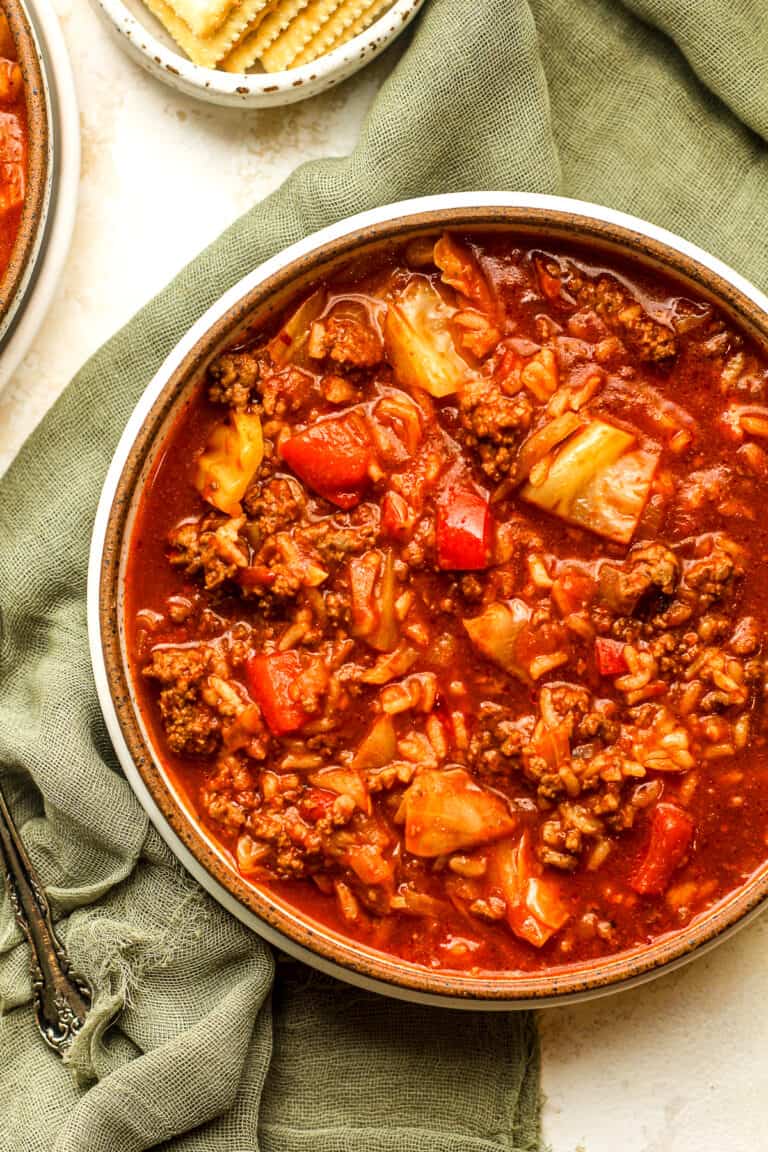 A bowl of cabbage roll soup with beef.