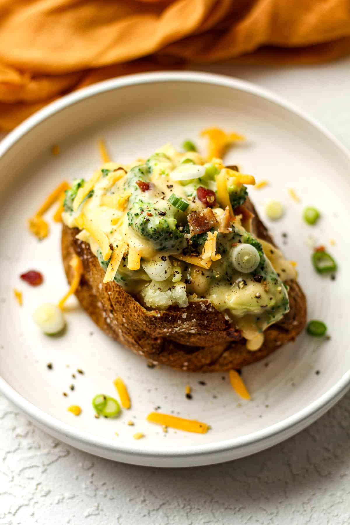 Side view of a loaded baked potato.