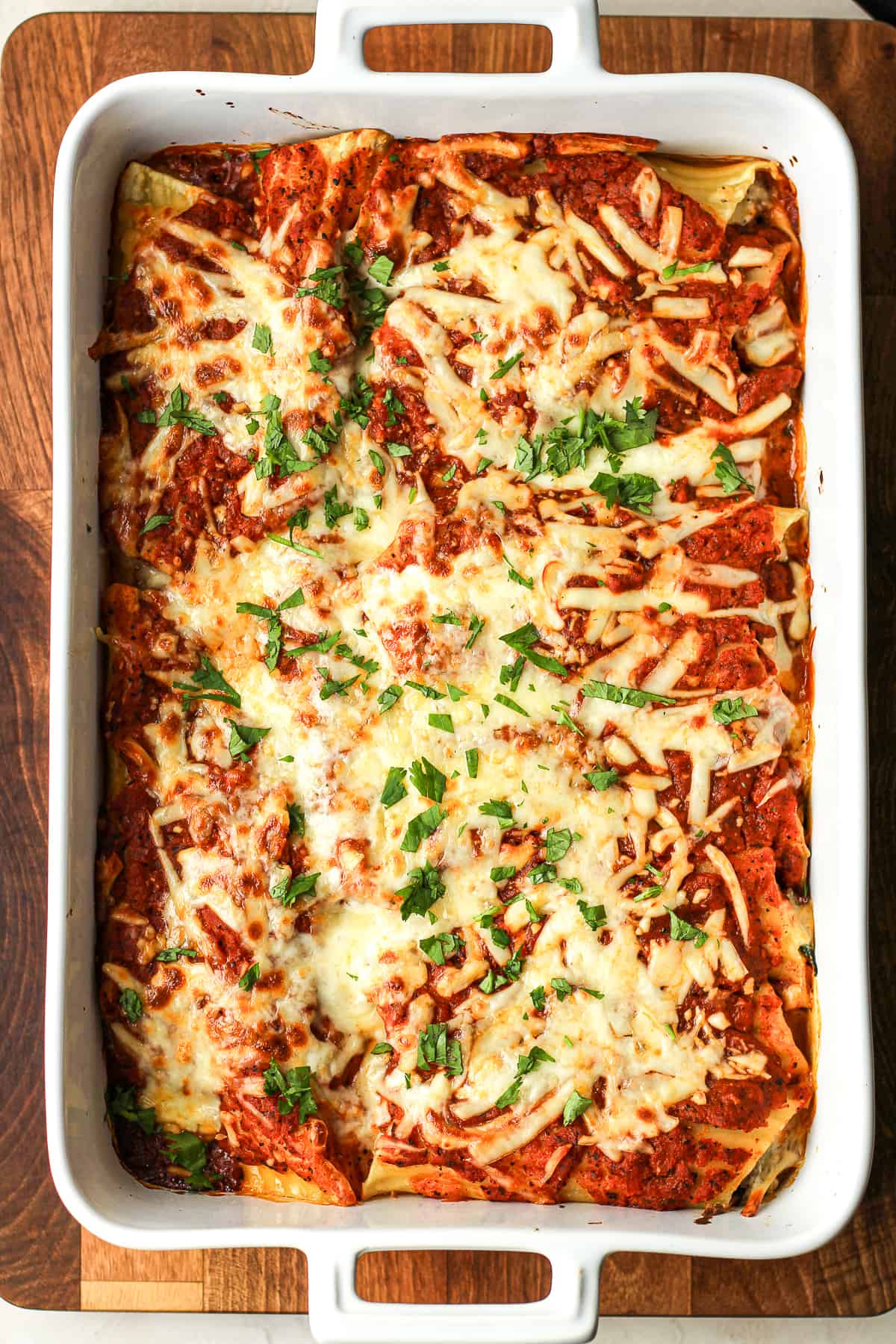 A large casserole of beef and cheese manicotti.