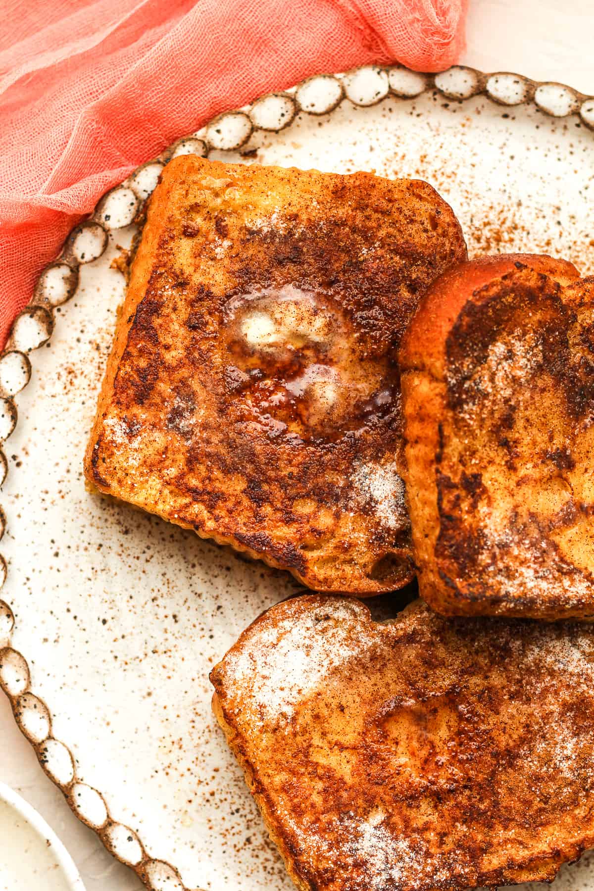 Closeup on a plate of cinnamon sugar French toast.