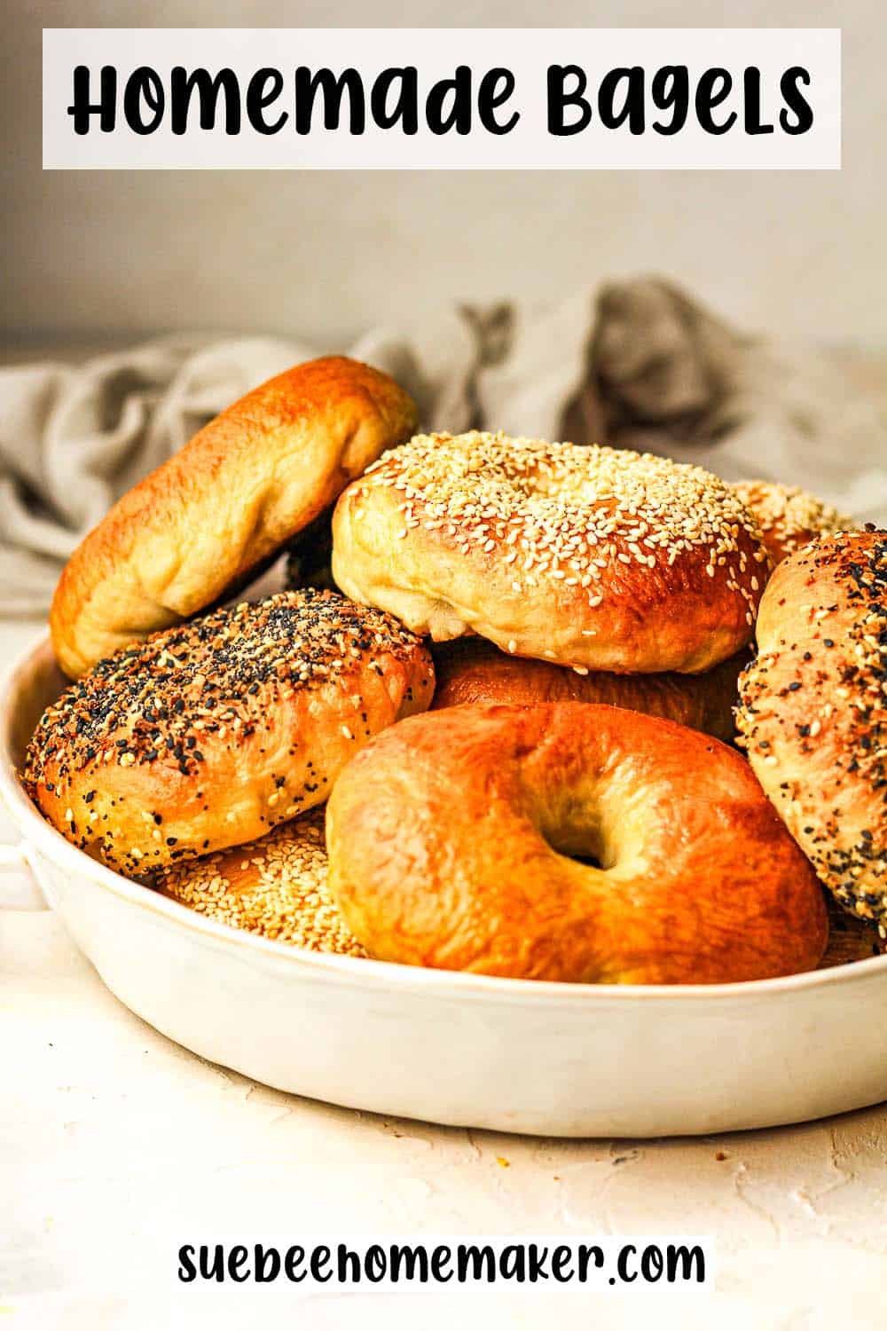 Side view of a bowl of homemade bagels with various toppings.