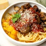 Closeup on a bowl of spaghetti, meatballs and homemade marinara.