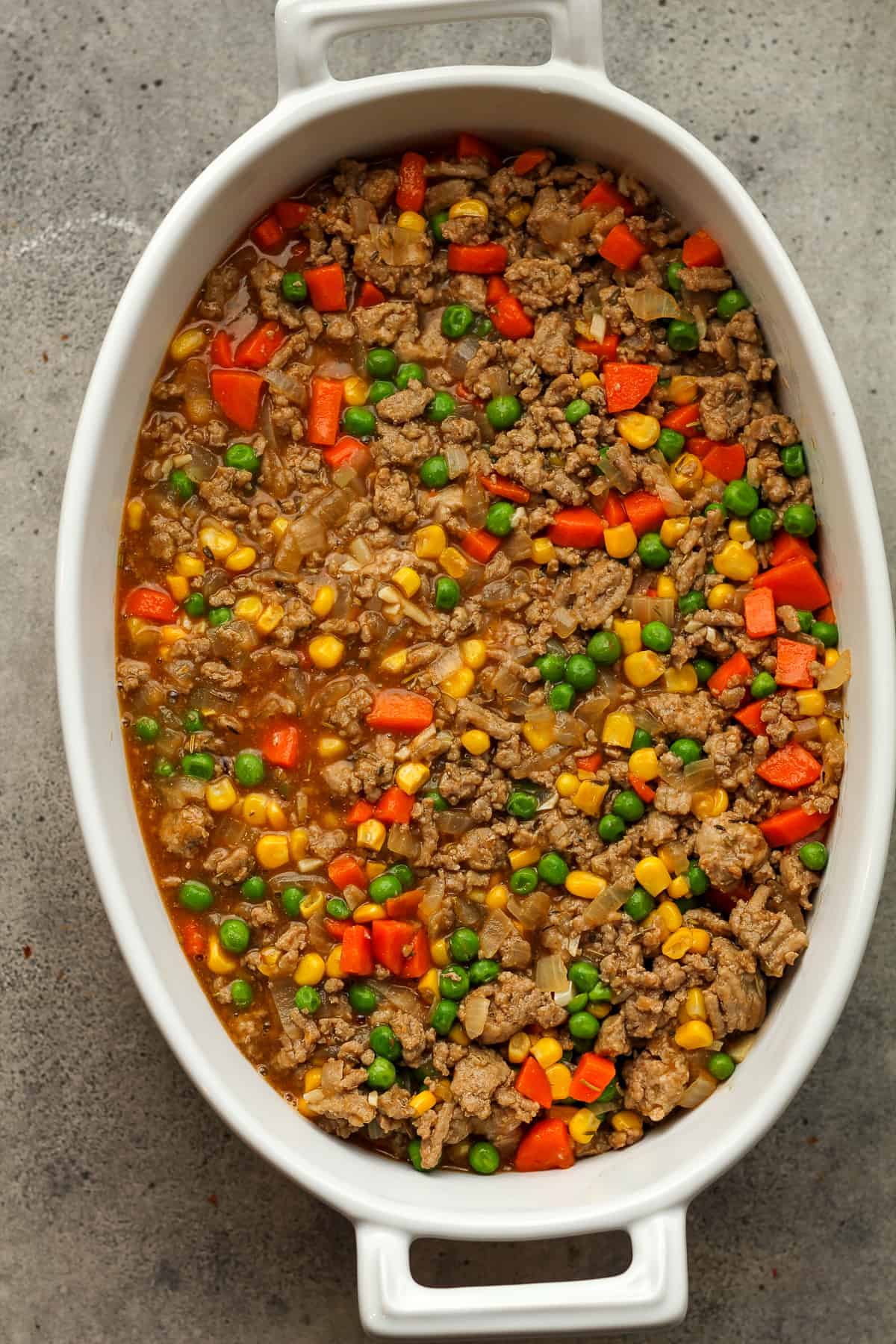 A dish of the ground turkey and veggies in an oblong dish.