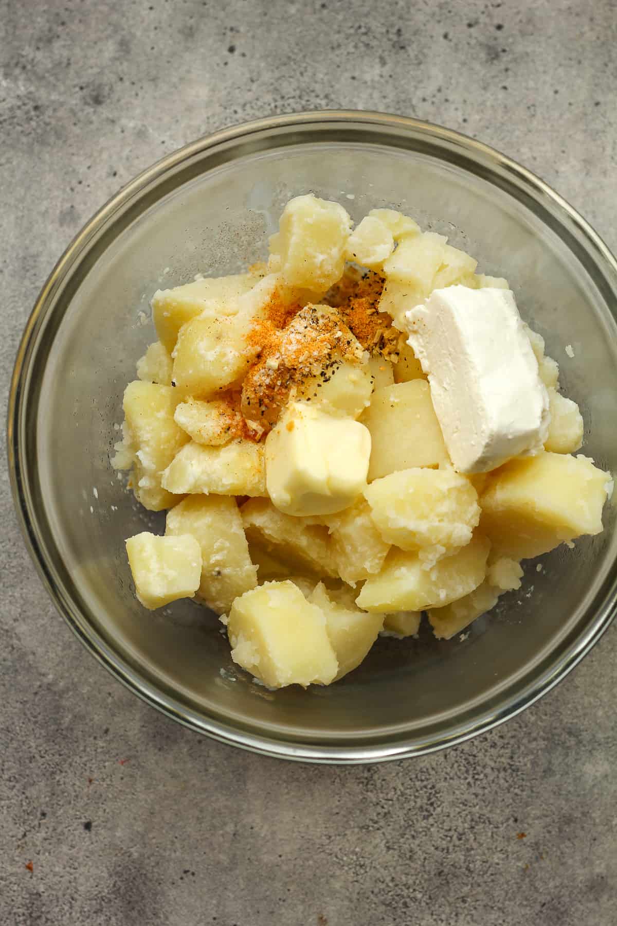 A bowl of the potato chunks with the mix-ins on top.