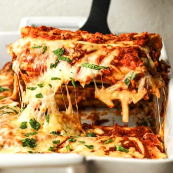 Closeup on a serving of beef and cheese manicotti.