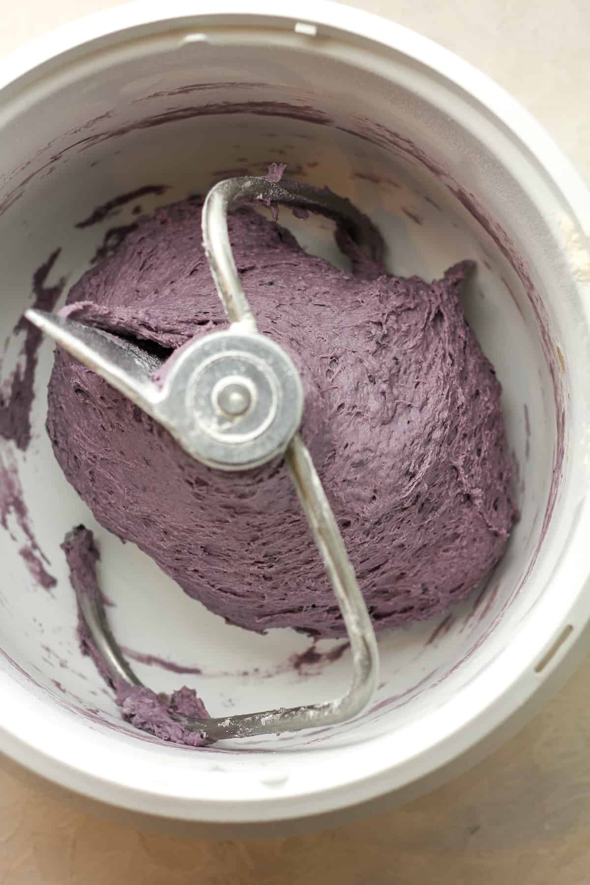 A mixer with the blueberry bagel dough.